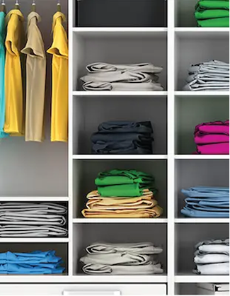 Neatly organized closet, with clothes hung and folded